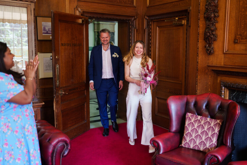 Newly married couple standing together inside the Mayor’s Parlour at Islington Town Hall.