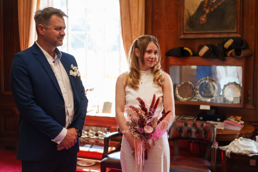 Bride holding her bouquet during the ceremony inside Islington Town Hall.