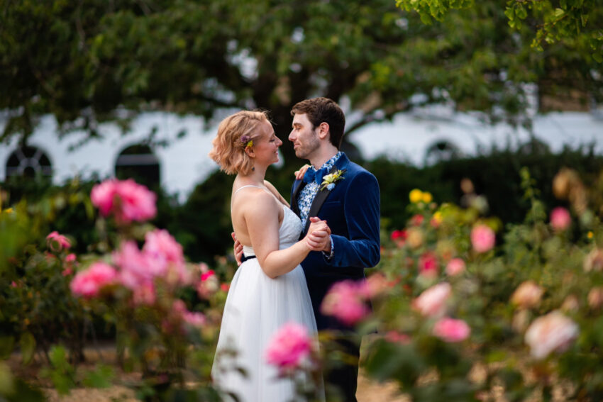 Bride and groom sharing a quiet moment together in a garden after their Islington Town Hall wedding.
