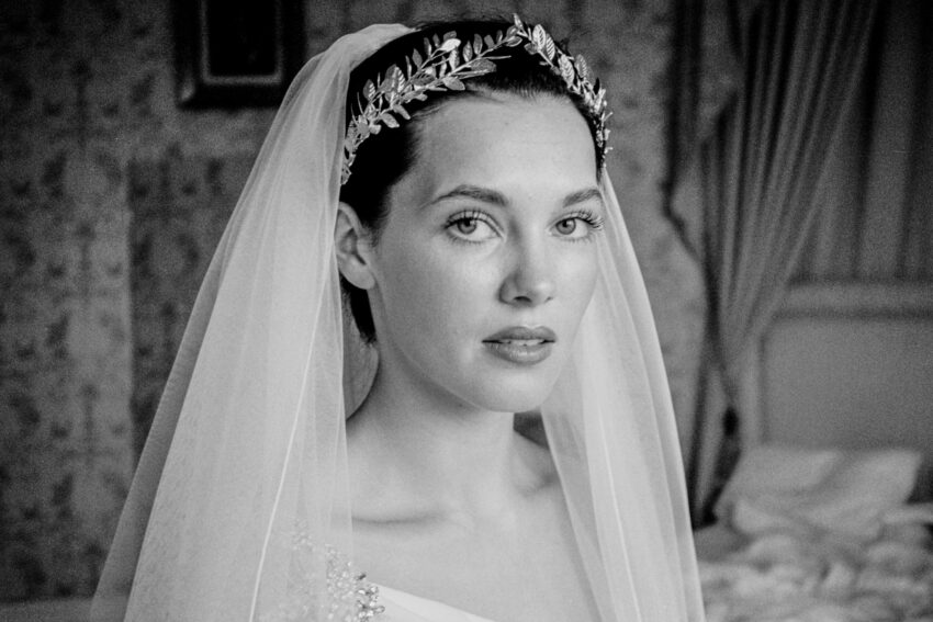 Bride in veil with delicate headpiece, photographed on film.