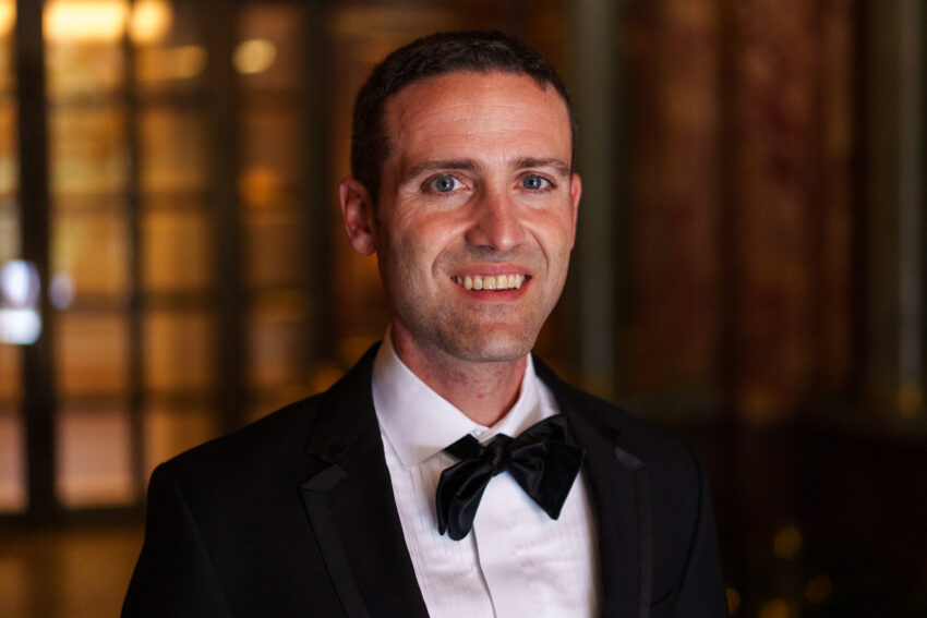 Groom portrait during evening wedding celebrations at Kimpton Fitzroy.