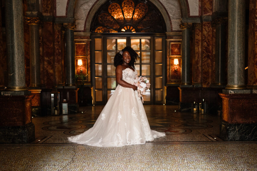 Bride standing in the ornate interior of Kimpton Fitzroy London.