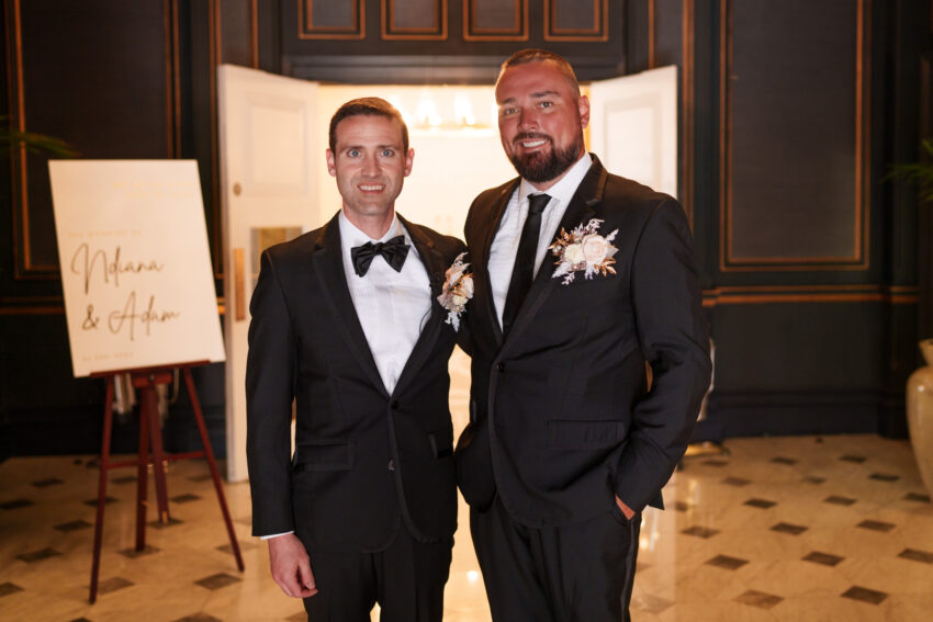 Groom portrait with best man during the wedding reception.