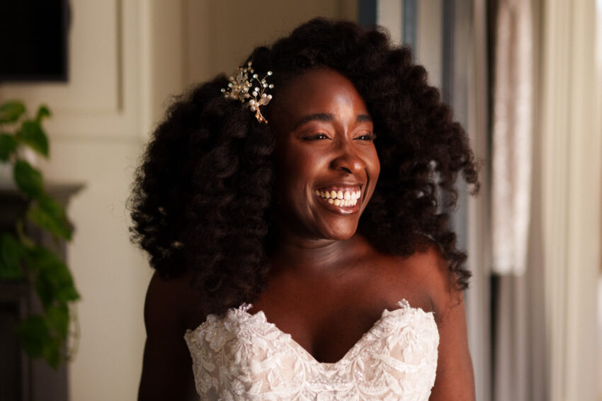 Bride smiling during bridal preparations at Kimpton Fitzroy London.