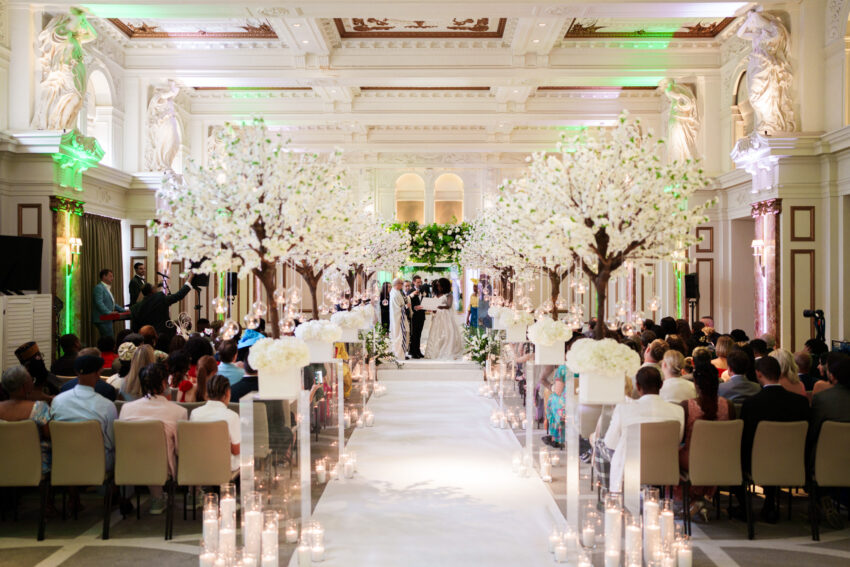 Wedding ceremony underway inside the grand ballroom at Kimpton Fitzroy London.