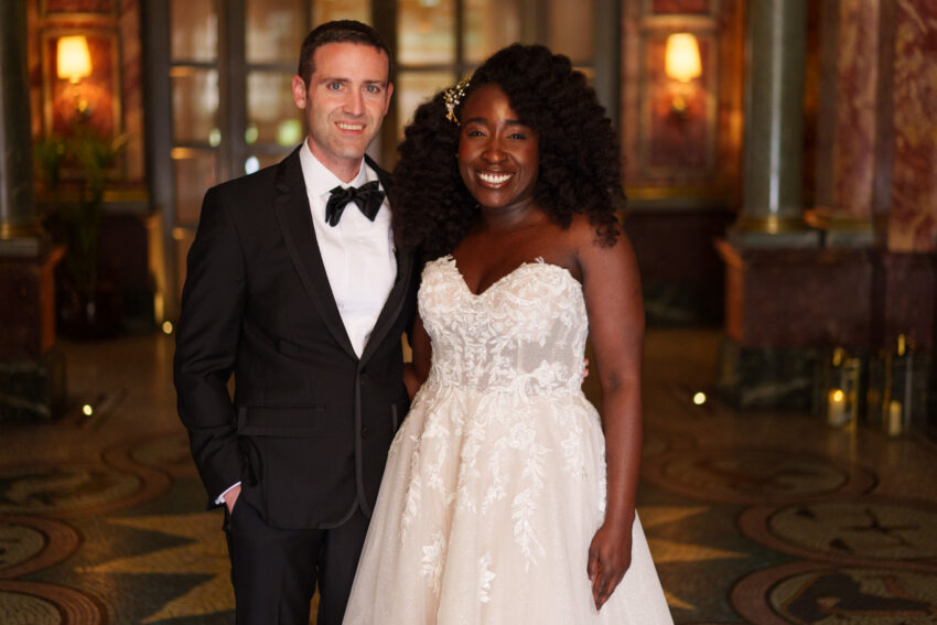 Bride and groom portrait outside Kimpton Fitzroy London at night.