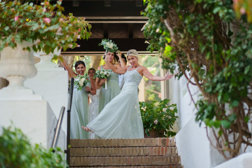 Bridesmaids celebrating during cocktail hour at Marbella Club Hotel.