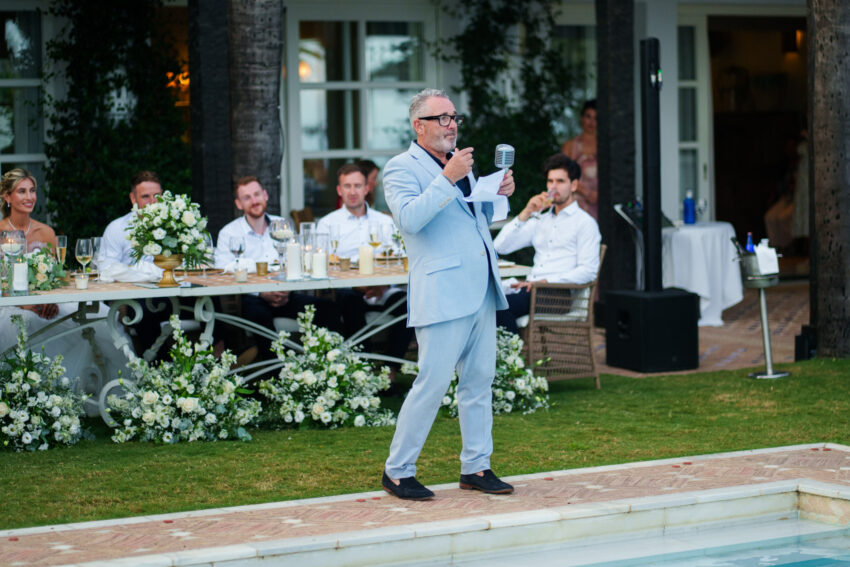 Wedding singer entertaining guests during outdoor reception at Marbella Club Hotel.