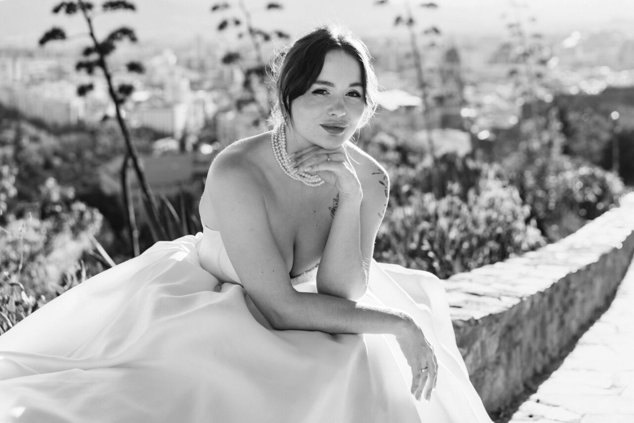 Bridal portrait at Gibralfaro hill overlooking Malaga, black and white image by a Malaga wedding photographer.