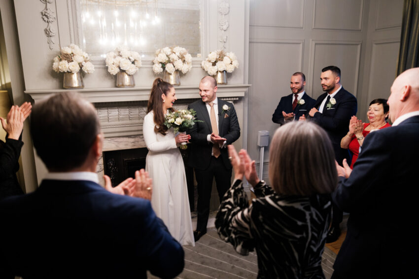 Guests applauding the couple at the end of their ceremony in the Pimlico Room.