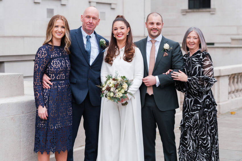 Bride and groom with family members after their ceremony at Old Marylebone Town Hall.