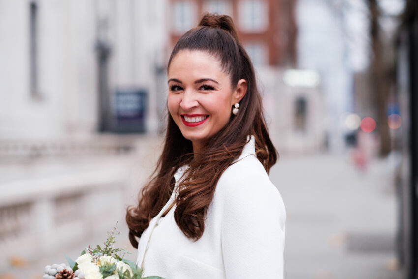Portrait of the bride smiling outside Old Marylebone Town Hall.