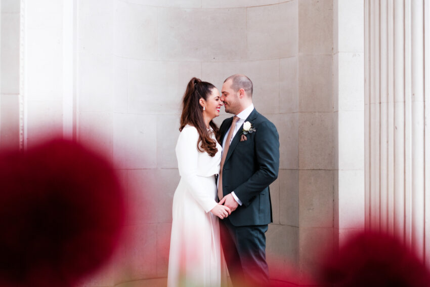Bride and groom sharing a quiet moment together outside Old Marylebone Town Hall.
