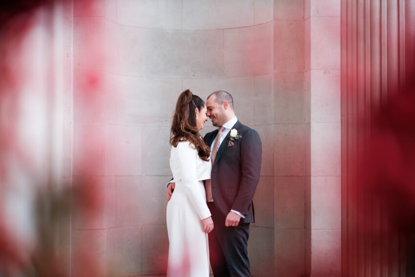 Bride and groom sharing a quiet moment together outside Old Marylebone Town Hall.