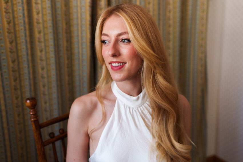 Portrait of the bride by the window before her Tahoe Mountain Home wedding.