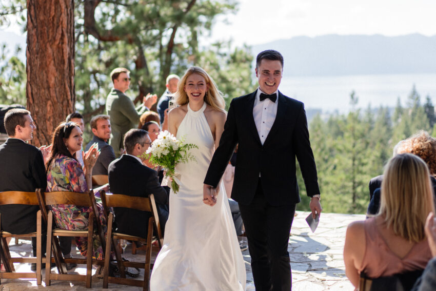 Newly married couple walking back down the aisle after their Lake Tahoe ceremony.