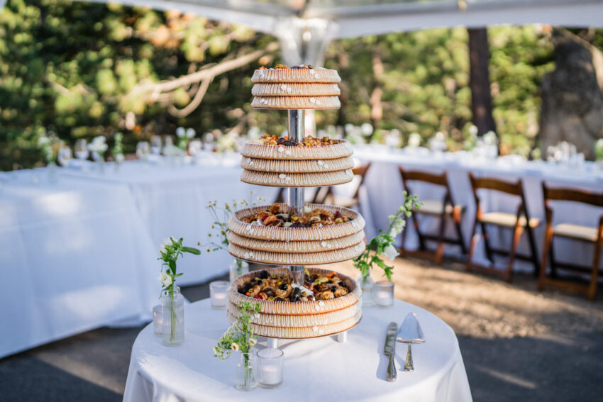 Wedding dessert display set up outdoors at Tahoe Mountain Home reception.