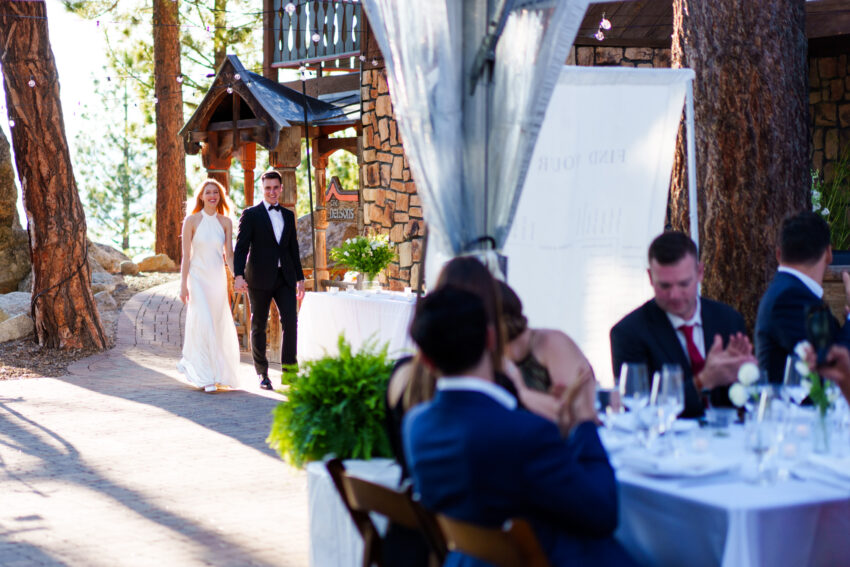 Bride and groom entering their wedding reception at Tahoe Mountain Home in South Lake Tahoe.