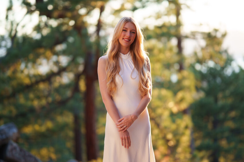 Bride posing alone during sunset portraits at Tahoe Mountain Home in South Lake Tahoe.