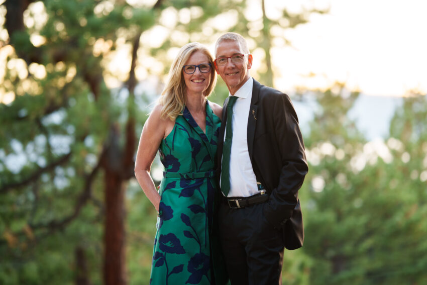 Bride’s parents posing together during sunset portraits at Tahoe Mountain Home.