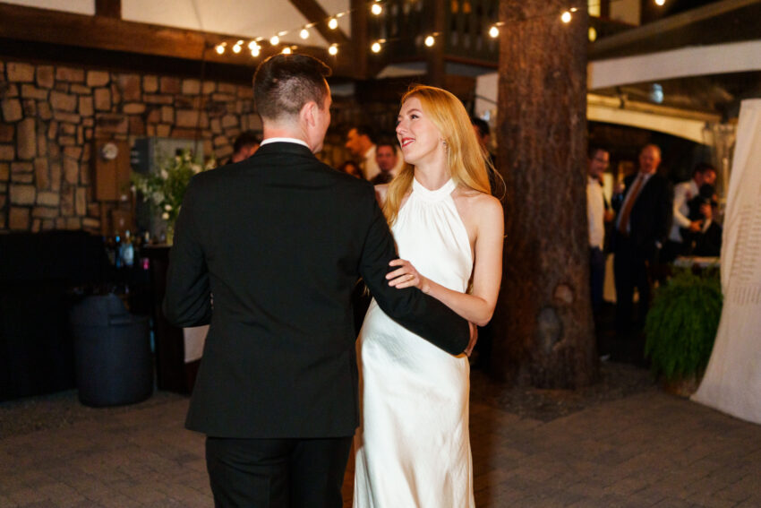 Bride and groom sharing their first dance during the evening reception at Tahoe Mountain Home.