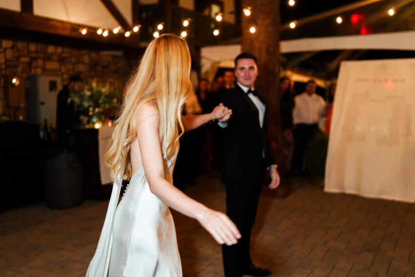 Bride spinning across the dance floor during the reception celebration in South Lake Tahoe.