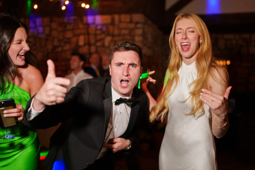 Bride and groom celebrating with friends on the dance floor during their Lake Tahoe wedding reception.