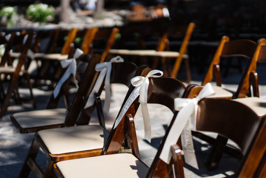 Wooden ceremony chairs set up outdoors for a wedding at Fjeldheim Tahoe Mountain Home.