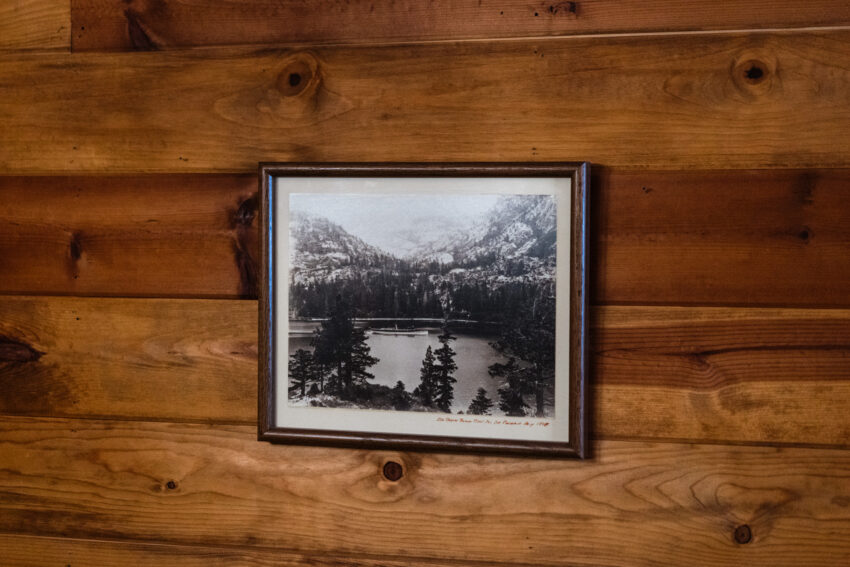 Framed photograph of Lake Tahoe hanging on the wooden wall inside Tahoe Mountain Home.
