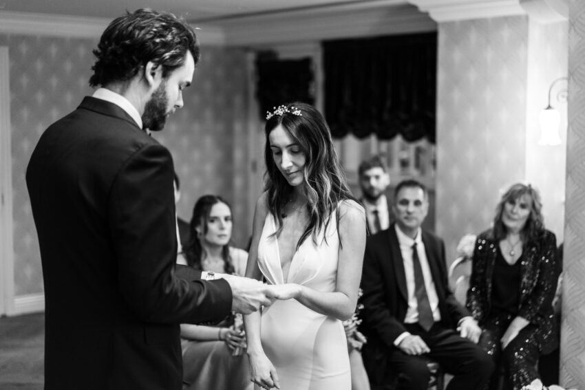 Intimate indoor wedding ceremony at The Graduate Cambridge wedding venue.