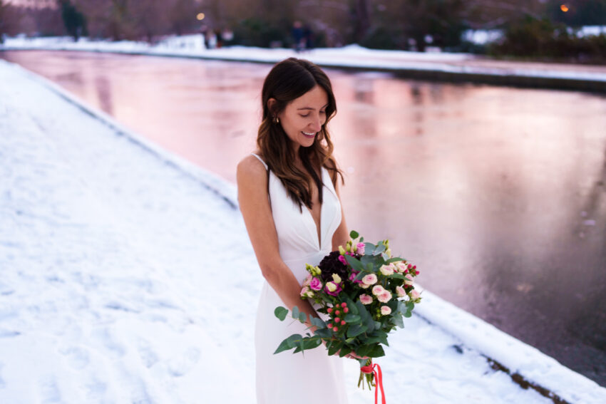 Winter bridal portrait beside the River Cam at The Graduate Cambridge wedding venue.
