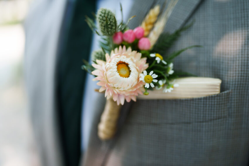 Close-up of a groom’s boutonniere during a wedding at Trillium Resort & Spa in Ontario.