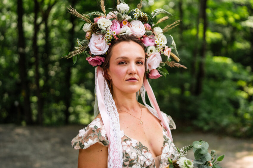 Close portrait of the bride wearing a floral crown during a Trillium Resort & Spa wedding.