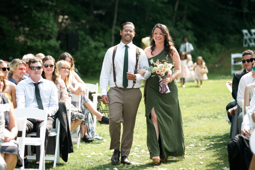 Wedding party walking down the aisle during the outdoor ceremony at Trillium Resort & Spa in Muskoka.