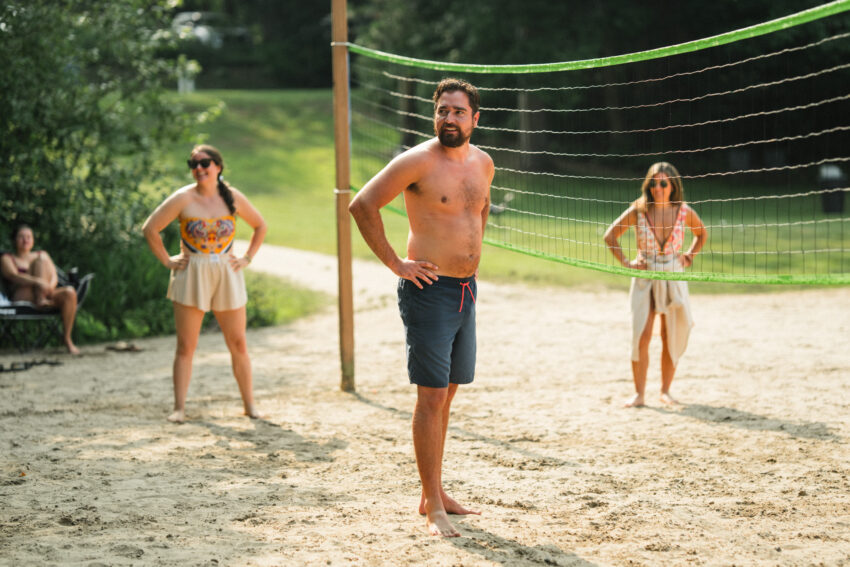 Guests playing beach volleyball on the sand court at Trillium Resort & Spa in Muskoka.