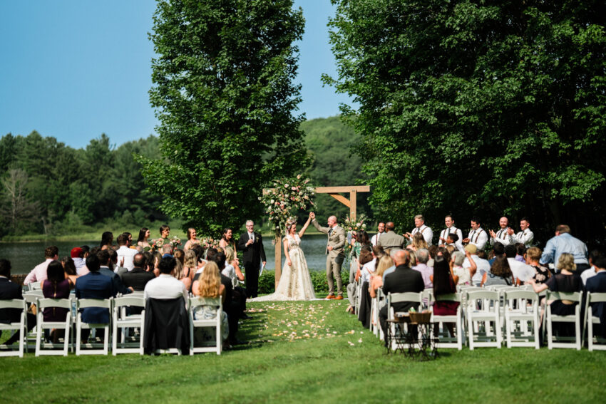 Bride and groom celebrating during the outdoor ceremony at Trillium Resort & Spa.