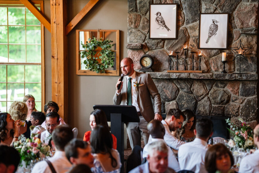 Groom giving a speech during the reception inside the lodge at Trillium Resort & Spa in Muskoka.