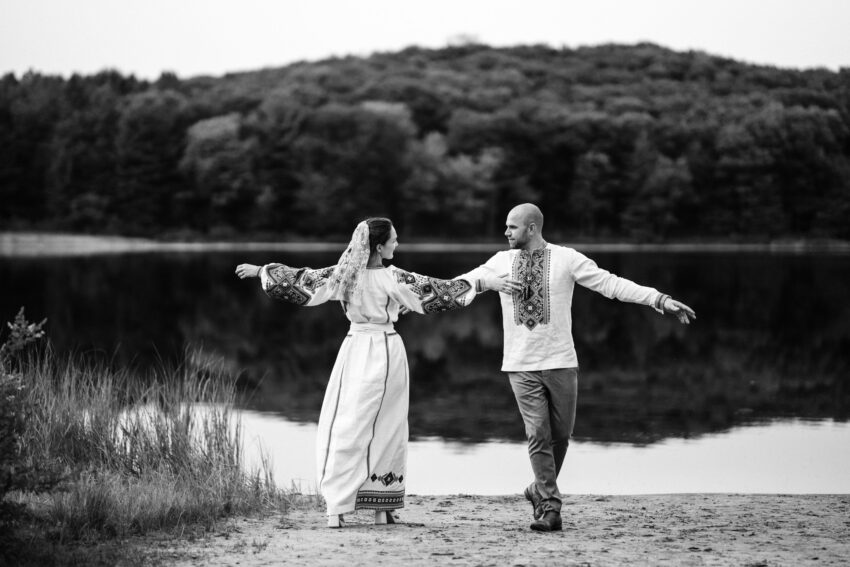 Black and white photo of the bride and groom dancing by the lake at Trillium Resort & Spa.