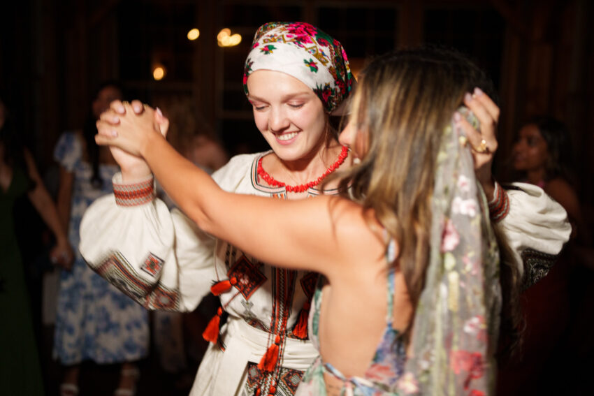 Bride dancing with a guest during the evening celebration at Trillium Resort & Spa in Muskoka.
